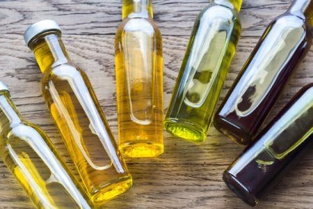 Darker Bottles and Opaque Tins Protect the Oil From the Light