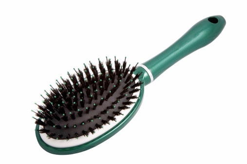 Oval Brush for Styling Your Hair Into Buns and Ponytails